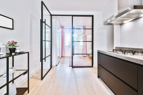 Opened,Glass,Door,Leading,Into,Bedroom,From,Stylish,Kitchen,In