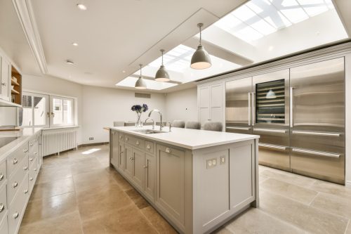 A,Kitchen,With,An,Island,And,Skylight,Over,The,Sink