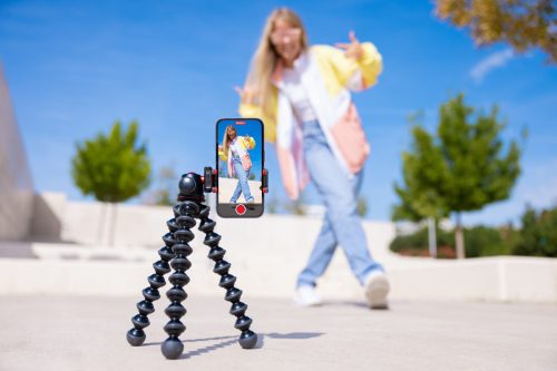 Teenage,Girl,Filming,Video,Of,Herself,On,Mobile,Phone